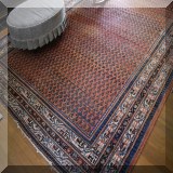 D63. Red handknotted rug with border 7'8” x 11'2” - $595 